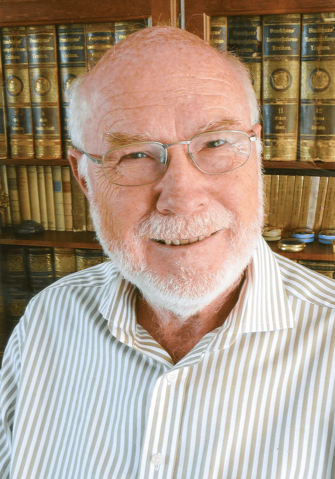 Image may contain Dave Hunt Face Head Person Photography Portrait Book Indoors Library Publication and Adult