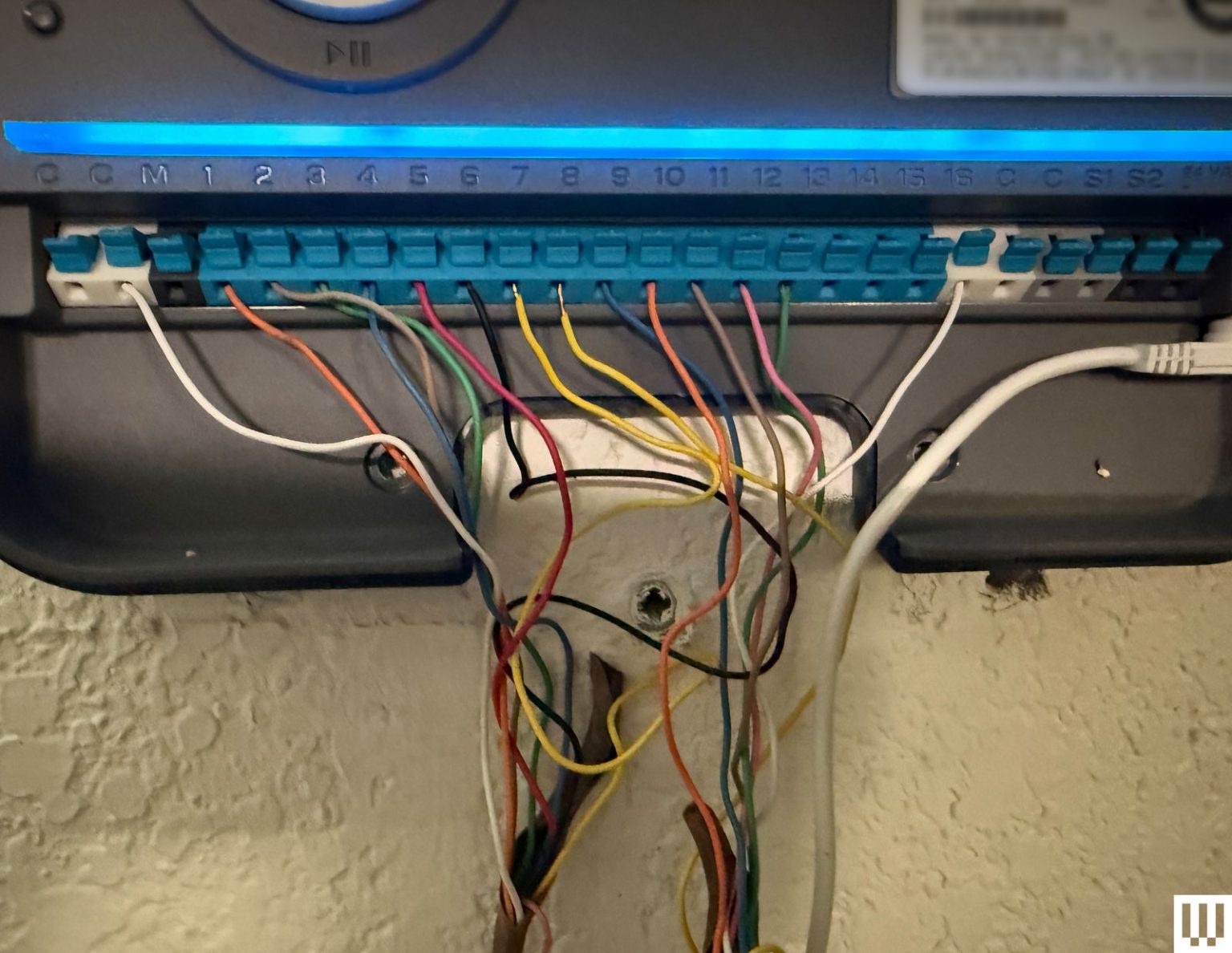 Back of a device with lots of wires coming out