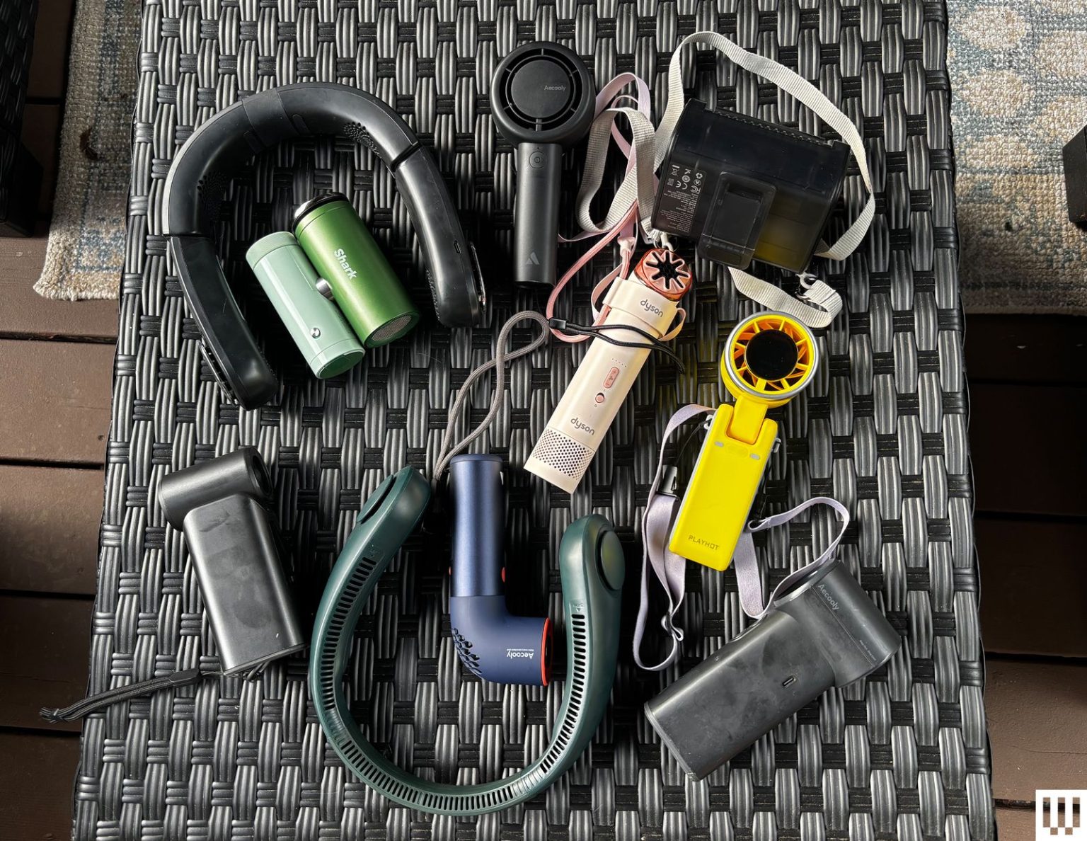 Best Handheld Fans and Wearable Fans (2026) Image may contain Bottle Shaker Ammunition Bomb and Weapon