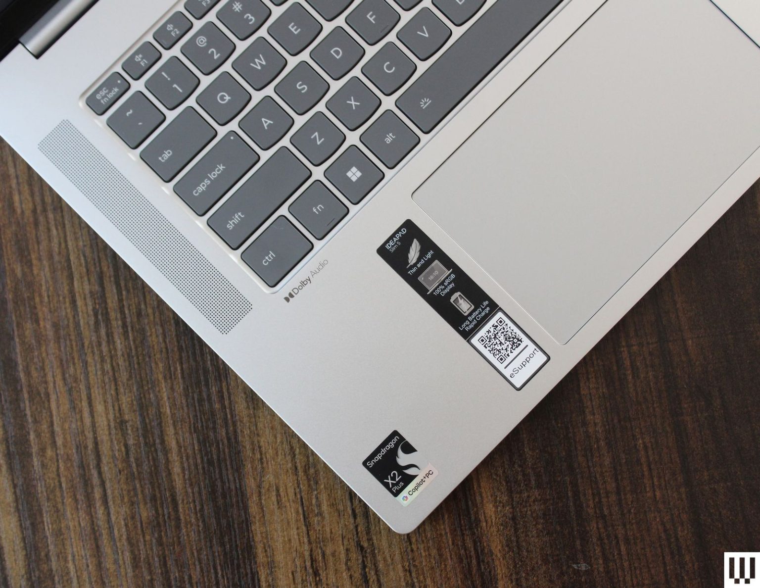 Lenovo IdeaPad Slim 5x Review: The Best Laptop Under $1,000 Overhead view of silver laptop showing the speaker touchpad and keys