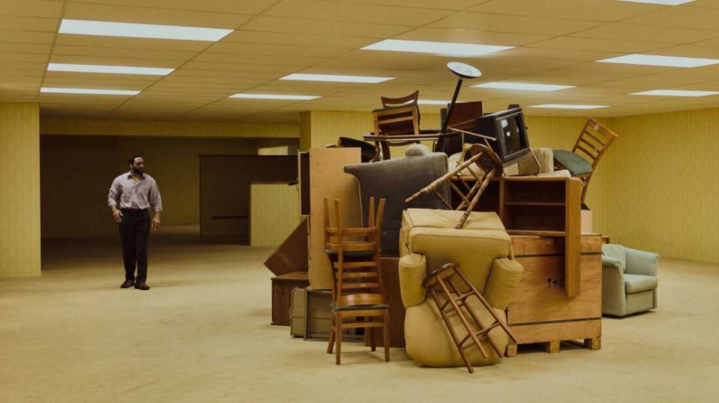Chiwetel Ejiofor plays Clark, a furniture store owner who wanders into a mysterious storage space in Backrooms.