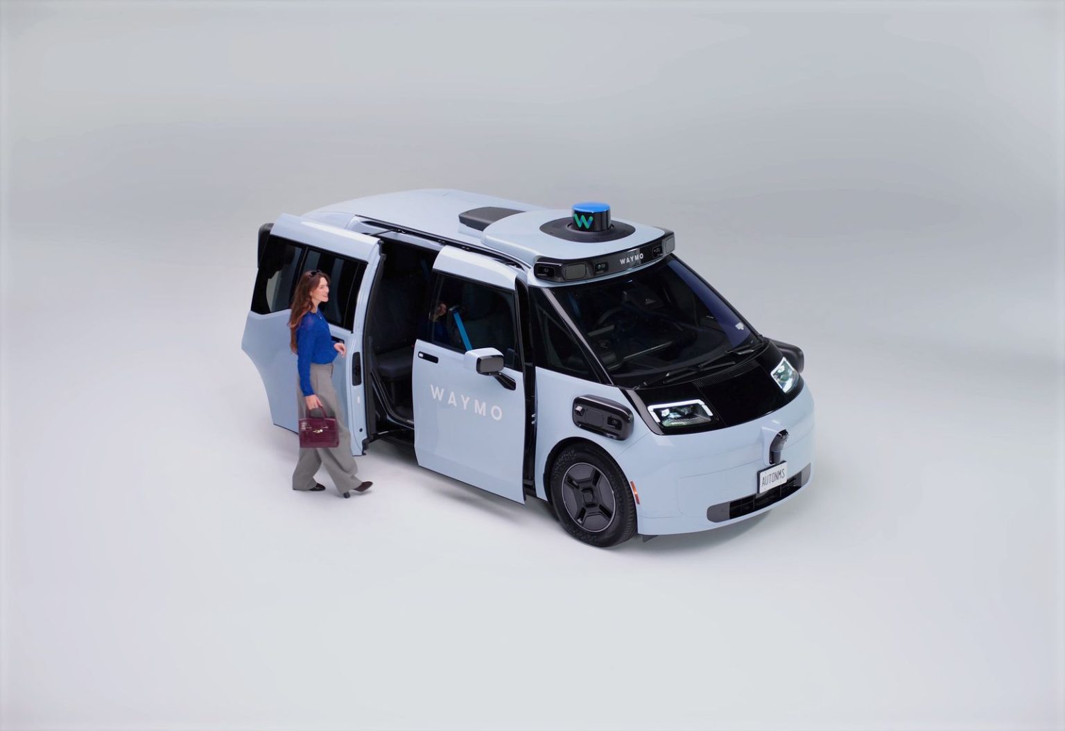 Free Waymo Rides in California? You Can Thank a Regulatory Quirk Image may contain Carolyn Hennesy Adult Person Accessories Bag Handbag Car Transportation Vehicle and Clothing